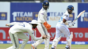Rain halts India push after Dinusha century lifts Sri Lanka