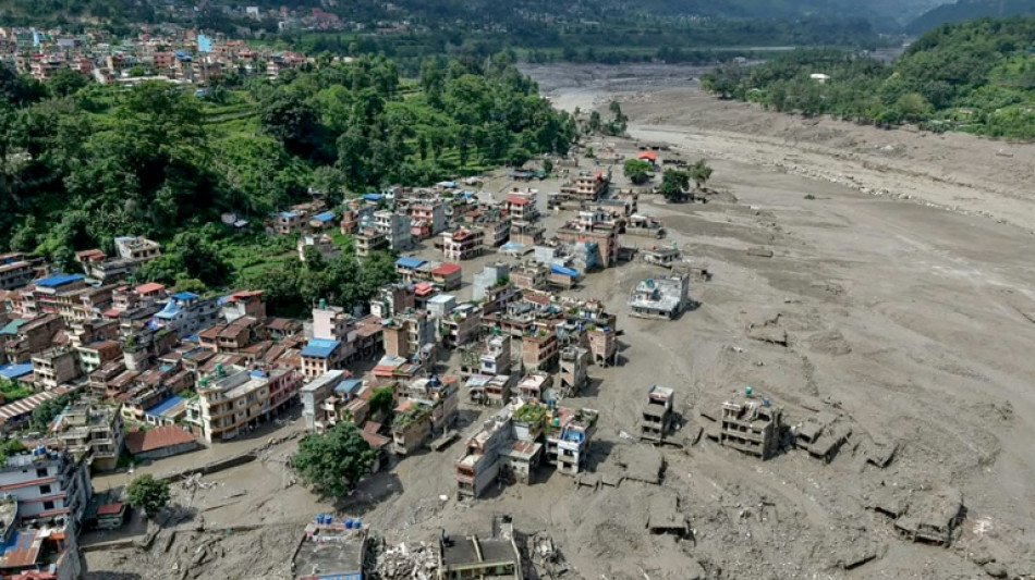 Search for missing after Nepal-Tibet floods kill 165