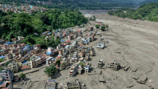 Search for missing after Nepal-Tibet floods kill 165