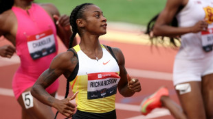 Richardson, Lyles ease through 100m heats at US trials