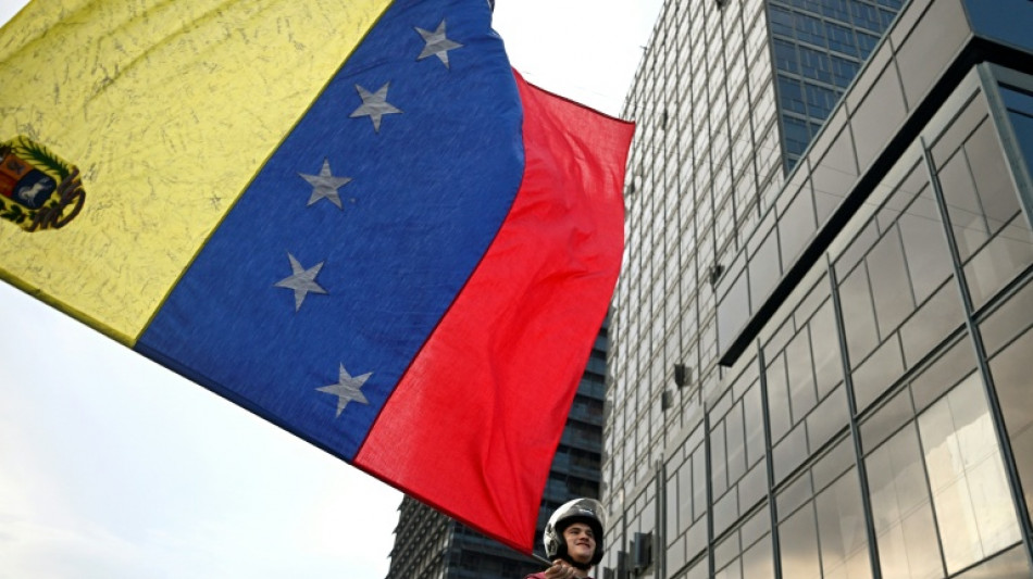 Venezuela protests demand return of Nobel winning leader Machado
