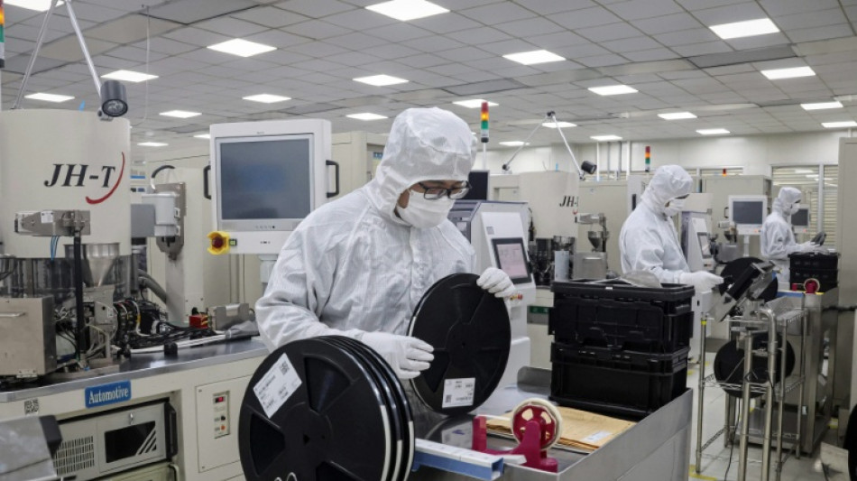 US slams China policies on chips but will delay tariffs to 2027