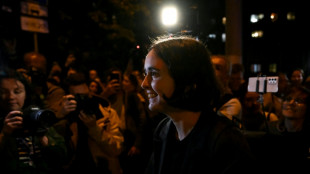 Russia slaps curfew on charity director over army criticism