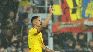 Lyon blow chance to go top after loss at Lens