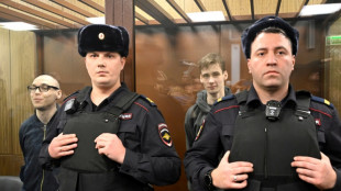 Two Russians get prison terms for poetry against Ukraine campaign